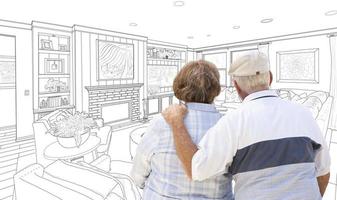 Senior Couple Looking Over Custom Living Room Design Drawing photo