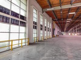 Massive Empty Industrial Warehouse Interior photo