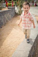 Young Chinese and Caucasian Boy Having Fun at the Park. photo