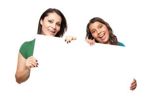 Pretty Hispanic Girl and Mother Holding Blank Board photo