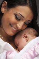 Attractive Ethnic Woman with Her Newborn Baby photo