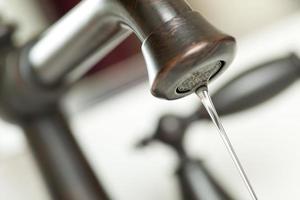 Water Dripping from Water Faucet photo