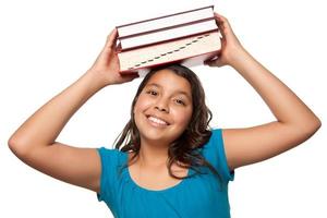 Pretty Hispanic Girl with Books on Her Head photo