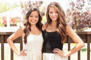 Two Mixed Race Girlfriends Pose for Portrait Outdoors photo