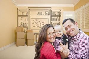 familia joven en la habitación con dibujo de unidad de entretenimiento en la pared foto