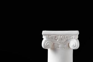 White Ionic Design Column on Dark Background photo