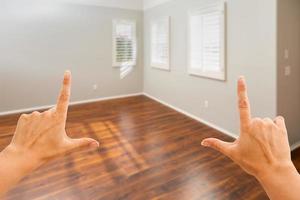Hands Framing Empty Room of New House photo