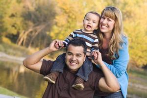 Happy Mixed Race Ethnic Family Posing for A Portrait photo