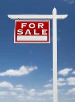 Left Facing For Sale Real Estate Sign on a Blue Sky with Clouds. photo