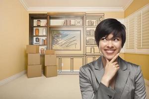 Mixed Race Female In Room With Drawing of Entertainment Unit photo