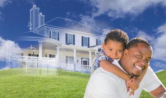 Mixed Race Father and Son with Ghosted House Drawing Behind photo