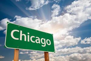 Chicago Green Road Sign Over Clouds photo