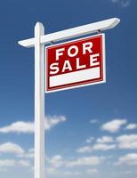 Right Facing For Sale Real Estate Sign on a Blue Sky with Clouds. photo