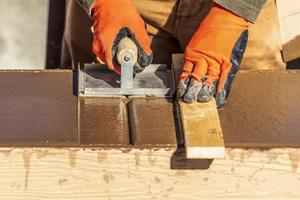 Construction Worker Using Hand Groover On Wet Cement Forming Coping Around New Pool photo