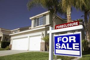 Blue Foreclosure For Sale Real Estate Sign and House photo