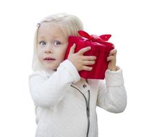 Baby Girl Holding Red Christmas Gift on White photo