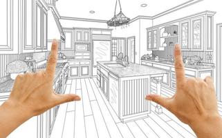manos enmarcando dibujo de diseño de cocina personalizado foto