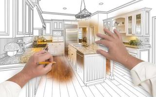 manos masculinas dibujando una cocina personalizada con una foto que se ve a través