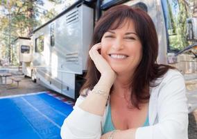 Attractive Middle Aged Woman Outdoor Portrait In Front of Class A RV photo