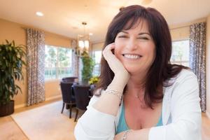 Attractive Middle Aged Woman Portrait Inside LIving Room At Home photo