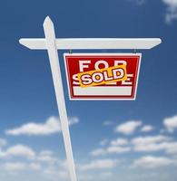 Right Facing Sold For Sale Real Estate Sign on a Blue Sky with Clouds. photo