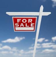 Left Facing For Sale Real Estate Sign on a Blue Sky with Clouds. photo