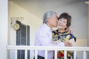 Attractive Chinese Couple Enjoying Their House photo