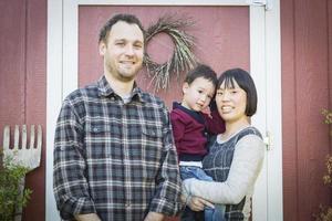 Mixed Race Family Having Fun Outside photo