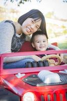 Chinese Mother Having Fun with Her Mixed Race Baby Son photo