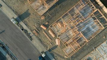 Drone Aerial View of Home Construction Site Foundations and Framing photo