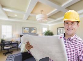 Contractor in Hard Hat Over Custom Bedroom Drawing and Photo