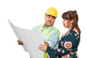 Hispanic Male Contractor Talking with Female Client Over Blueprint Plans Isolated on a White Background photo