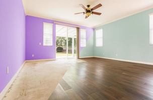 Empty Room with Cross Section Showing Before and After With New Wood Floor and Paint photo