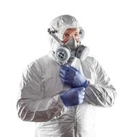 Man Wearing Hazmat Suit, Goggles and Gas Mask Isolated On White. photo