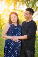 Hispanic Pregnant Young Couple Portrait Outdoors photo