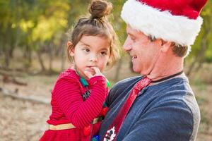 Festive Grandfather and Mixed Race Baby Girl Outdoors photo