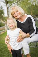 Grandmother and Granddaughter Playing At The Park photo