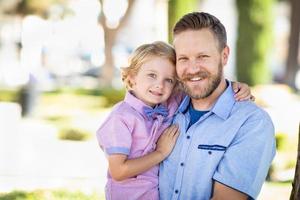 Young Caucasian Father And Son Portrait At The Park photo