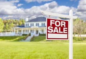 Home For Sale Sign in Front of New House photo