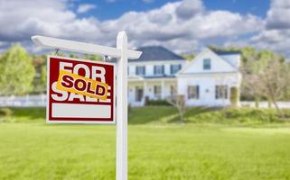 Sold Home For Sale Sign in Front of New House photo