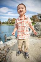Young Chinese and Caucasian Boy Having Fun at the Park and Duck Pond. photo
