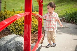 Young Chinese and Caucasian Boy Having Fun at the Park. photo