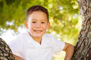 Outdoor portrait of a biracial Chinese and Caucasian boy. photo