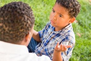 Happy African American Father and Mixed Race Son Playing At The Park photo