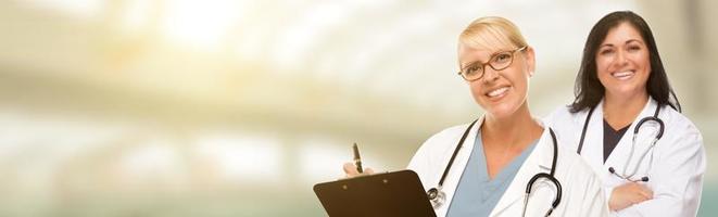 Caucasian and Hispanic Female Doctors, Nurses or Pharmacists with Room For Text. photo