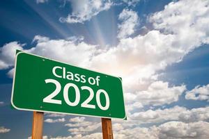 Class of 2020 Green Road Sign with Dramatic Clouds and Sky photo