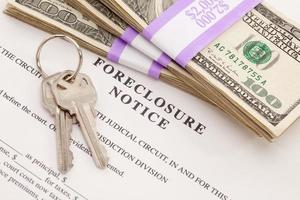 House Keys, Stack of Money and Foreclosure Notice photo