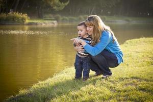 Happy Mother and Baby Son Looking Out At Lake photo