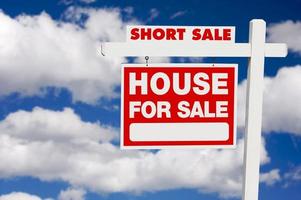Short Sale Real Estate Sign on Clouds photo