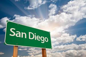 San Diego Green Road Sign Over Clouds photo